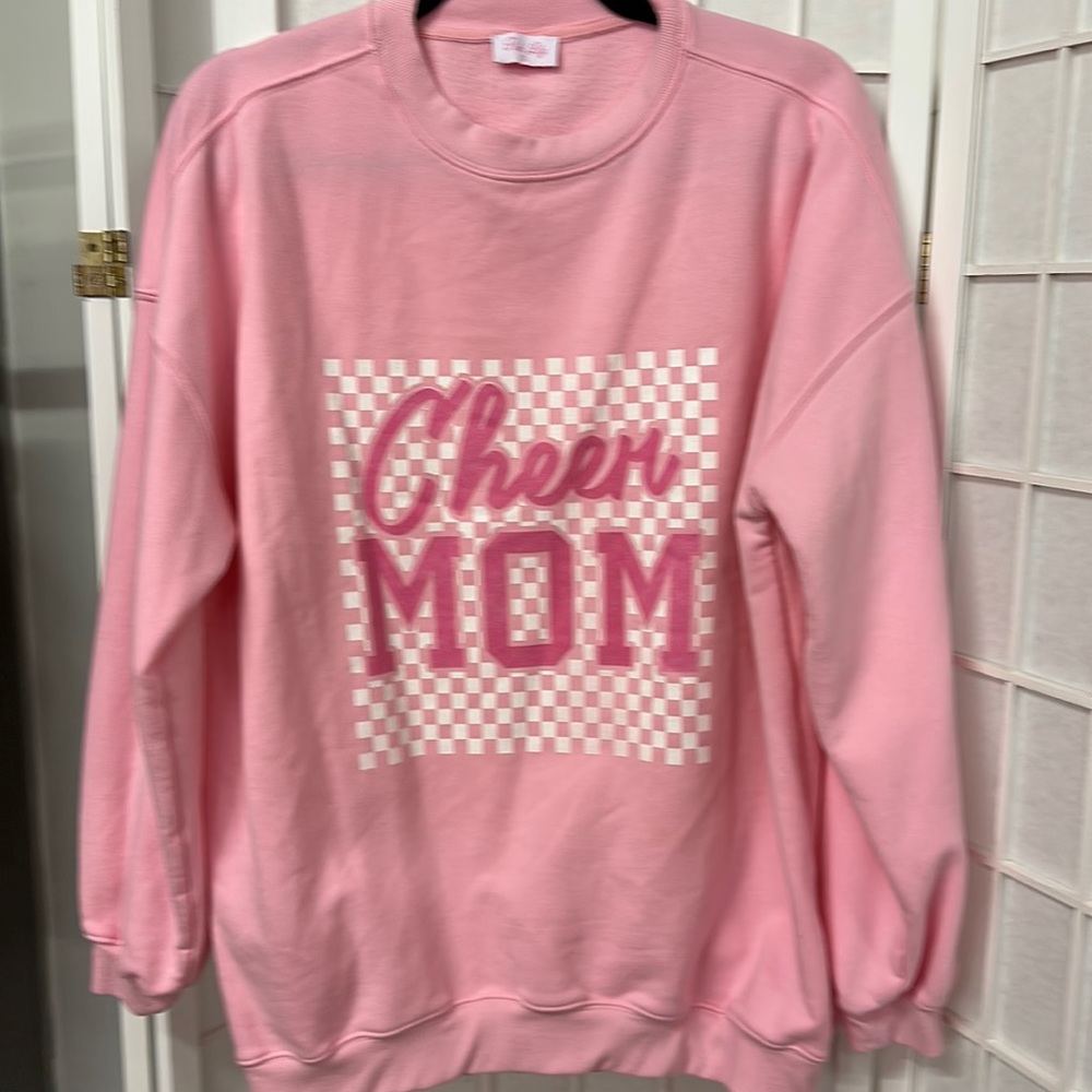 Pink Lily small pink oversized sweatshirt.  Cheer Mom logo. Good condition